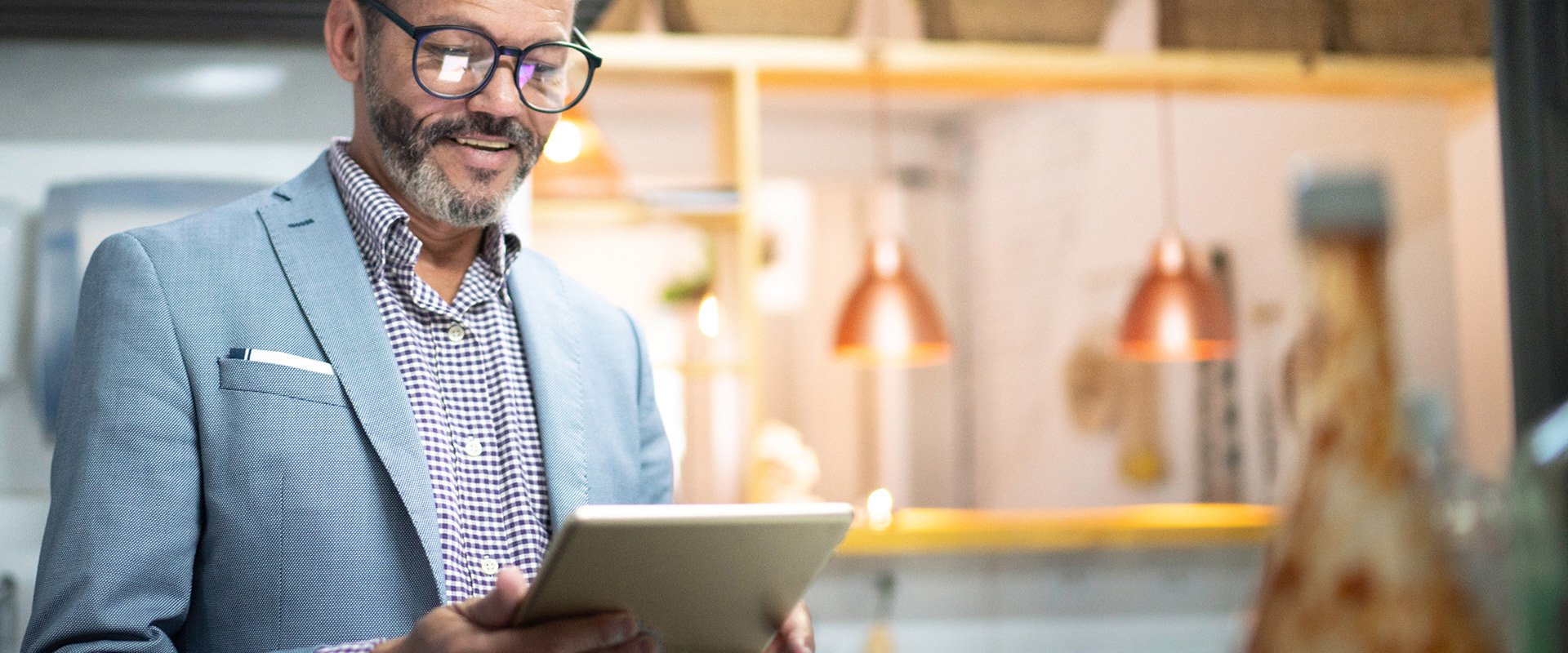 Energy manager looking at a tablet. Energy manager looking at a tablet.